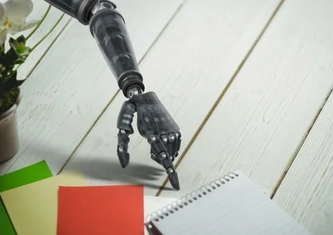 Robot hand pointing at spiral diary on wooden table Illustrazione stock