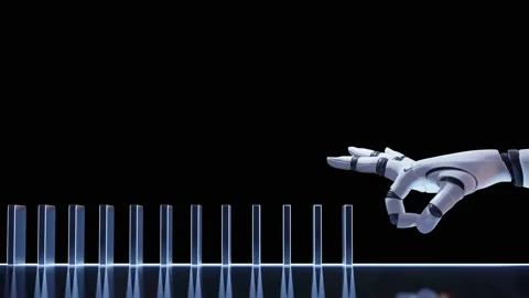 Robot hand pushing block creating domino effect Video stock 219815674
