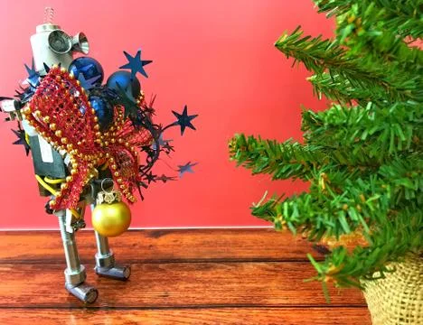 Robot with hands full of decorations Stock Photos