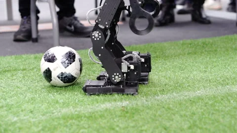 The robot hits the ball. Stock Footage 167669739