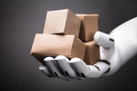 Robot Holding Cardboard Boxes Stock Photos