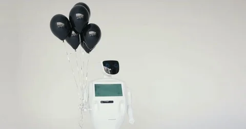 The robot holds balloons in its hands. Happy Birthday. Cybernetic system today Stock Footage 80421503