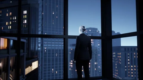 A robot humanoid staying in the empty office and looking out the window at the Stock Footage 256586482