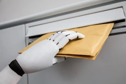 Robot Inserting Envelope In Mailbox Stock Photos