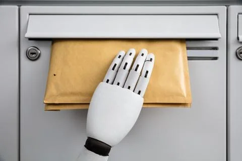 Robot Inserting Envelope In Mailbox 库存照片