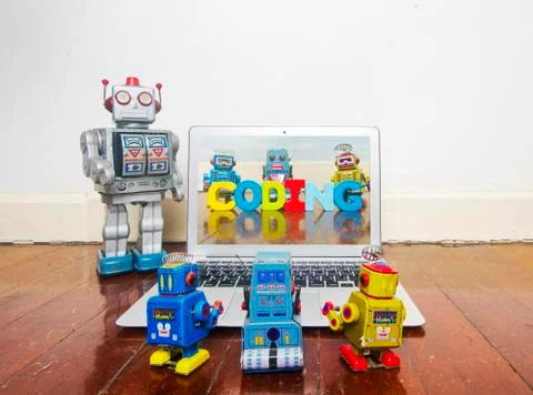 Robot kids learn code from a laptop Stock Photos