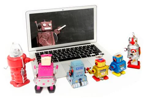Robot kids learning  from a  laptop computer  i 写真素材