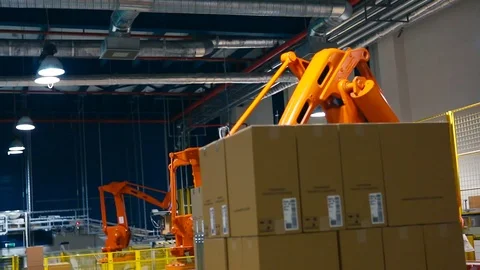 A robot lifting Packing with products Stock Footage 74288124