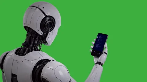 Robot looking at handheld device green screen medium shot Stock Footage 340479819