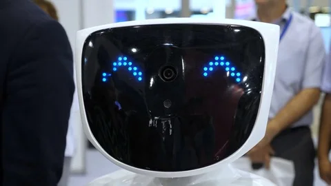 Robot looks at the camera and smiles. Modern Robotic Technologies. The robot Stock Footage 81123372