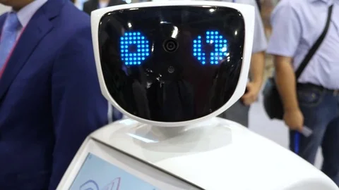 The robot looks into the camera and is surprised. Modern Robotic Technologies Stock Footage 80726296