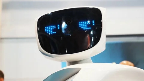 The robot looks into the camera and is surprised. Modern Robotic Technologies Stock Footage 81124639