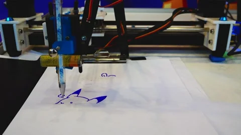 A robot machine draws a programmed image with a pen. Artificial intelligence. Stock Footage 264138897