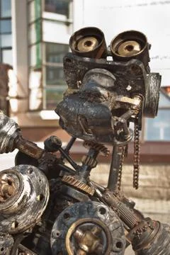 Robot made of rusty metal. Close up head of robot. Selective focus Stock Photos