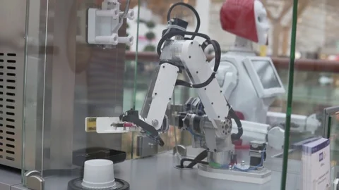 A robot makes ice cream in a mall. Stock Footage 113604503