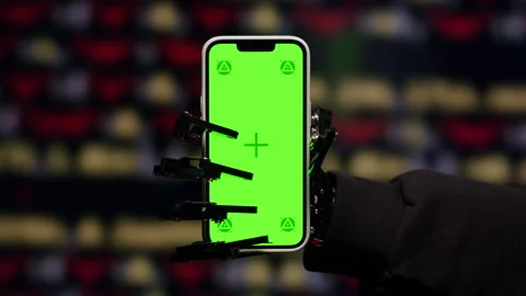 Robot Mechanical Arm Holding Green Mock-up Screen Smartphone, hand with phone AI Stock Footage 309636976