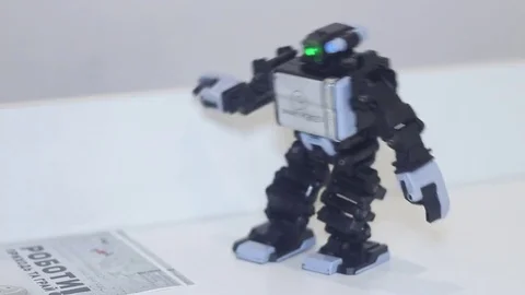 Robot moves away from man Stock Footage 81788518