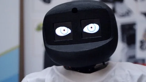 Robot moves its head and blinks its eyes close-up. Stock Footage 107723672