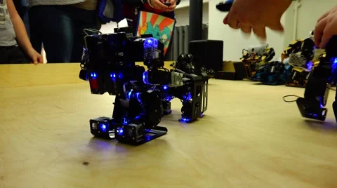 Robot. New technologies. AI. Children playing with robots. Stockbeeldmateriaal 50289259