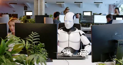Robot in office typing on keyboard. Cyborg using computer in coworking space Stock Footage 180022203