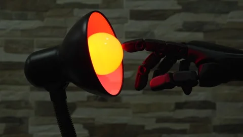 Robot or Prosthesis Hand Touching Glowing Smart Bulb in Desk Lamp Stock Footage 340550722