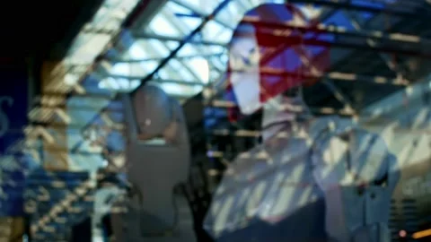 The robot is out of focus behind the glass. The future belongs to robots. The Stock Footage 157336957