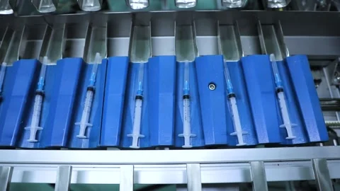 The robot is packing syringes into a bag Stock Footage 163088097