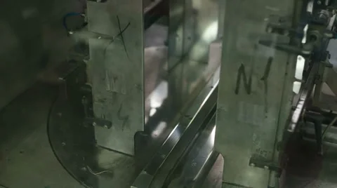 Robot packs in a large stack of newspapers Stock Footage 39146897