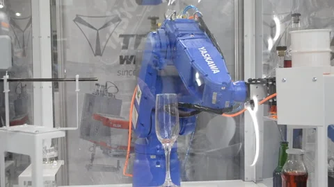 Robot performs task pouring drink glass industrial robot Industrial manipulators Stock Footage 324989843