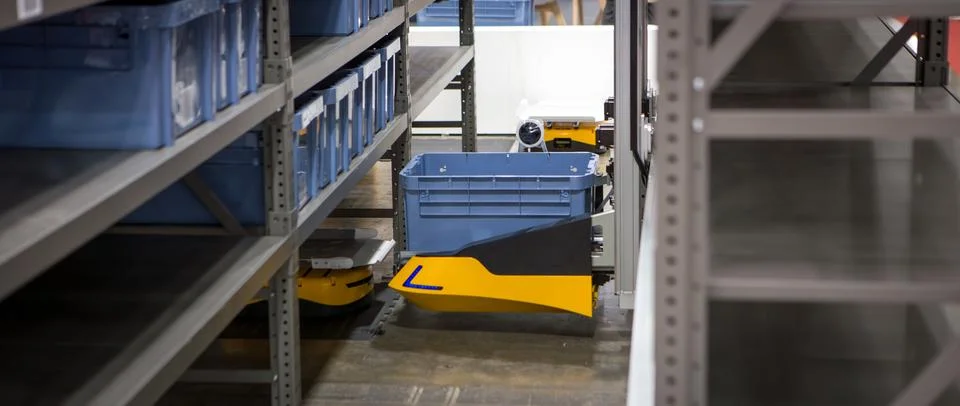 Robot picking materials from multi-layer rack Stock Photos