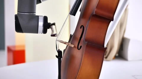 Robot playing cello, blending artificial intelligence with classical music Video stock 321348396