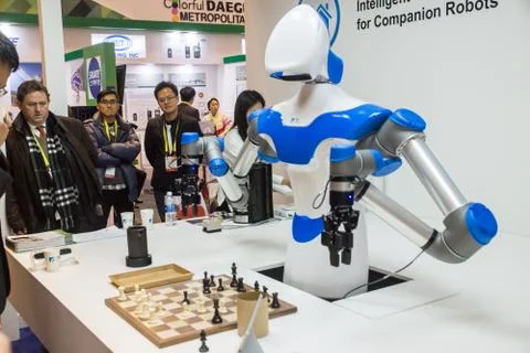 A Robot Plays Chess at CES 2017 Stock Photos