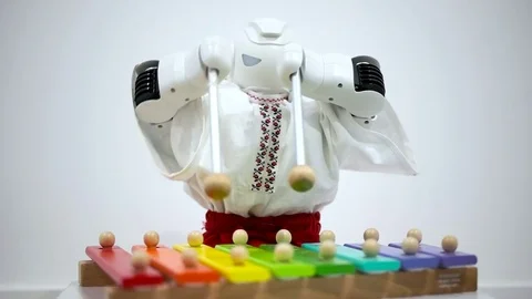 Robot plays a musical instrument Stock Footage 73418404