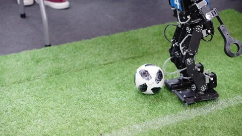 The robot plays with a soccer ball. Stock Footage 167669880