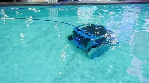 Robot pool cleaner. Pool maintenance with automatic robot. Stockbeeldmateriaal 241746323