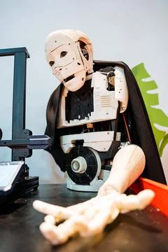 The robot reaches out. Bionic robot of white color. Artificial man. Android I Stock Photos