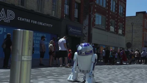 Robot rolling down a downtown street - London, Ontario. Stock Footage 158864094