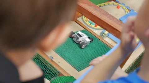 Robot searching for a way with an obstacles at a robot competitions. Stock Footage 85716734