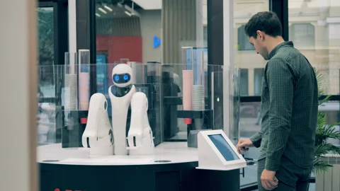 Robot is serving a client in a coffee shop Video stock 149474676