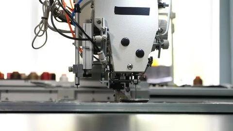 Robot sewing machine. automated machine embroider pattern on artificial leather Stock Footage 108066105