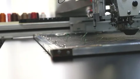 Robot sewing machine. automated machine embroider pattern on artificial leather Stock Footage 108370929