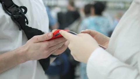 Robot is standing next to a person with a hand extended Stock Footage 311040113