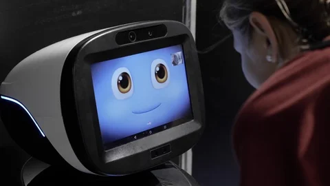 A robot talking with a girl. Stock Footage 126120918