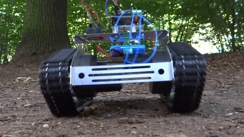 Robot Tank Driving in a Forest on The Ground Stock Footage 114070203