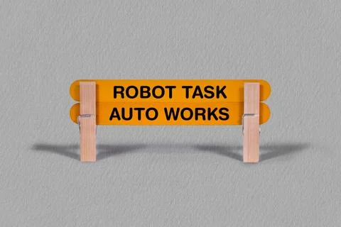 Robot Task, Auto Works word reveal on wodden stick wood texture bg Stock-Fotos