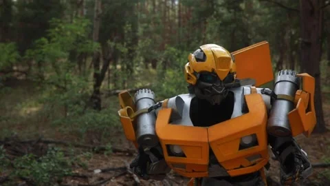 Robot transformer stands among forest. Stock Footage 138637219