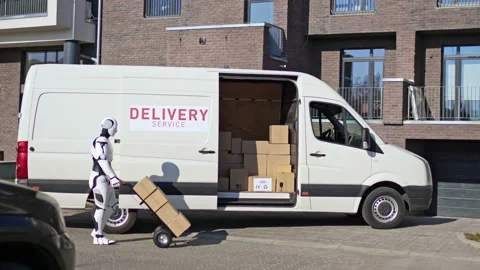 Robot with a trolley going to a van with parcel boxes to deliver them to Stock Footage 166173796