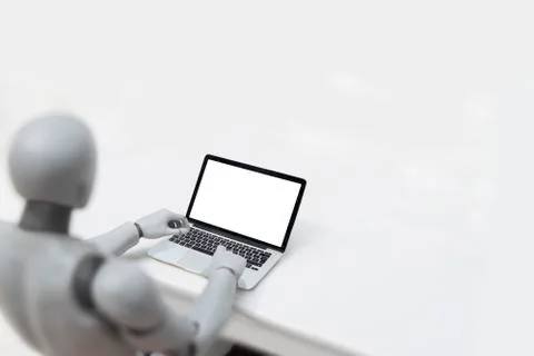 Robot using laptop - Artificial inteligence concept Stock Photos