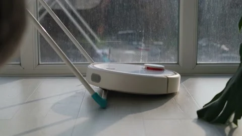 The robot vacuum cannot run over a furniture leg. Stock Footage 168817990