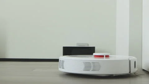 Robot vacuum cleaner automatic cleaning scattered rubbish, close-up Vídeos de archivo 164228859